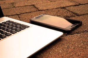 A Phone and a Laptop on the Ground